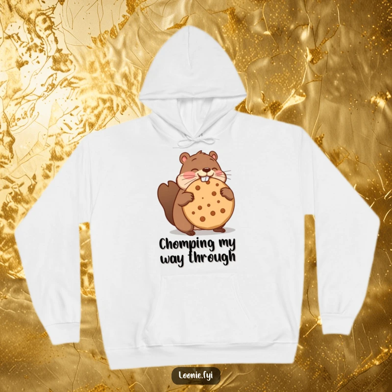 Funny hoodie depicting a beaver comically attempting to eat a massive maple cookie, its funny, oversized snack.